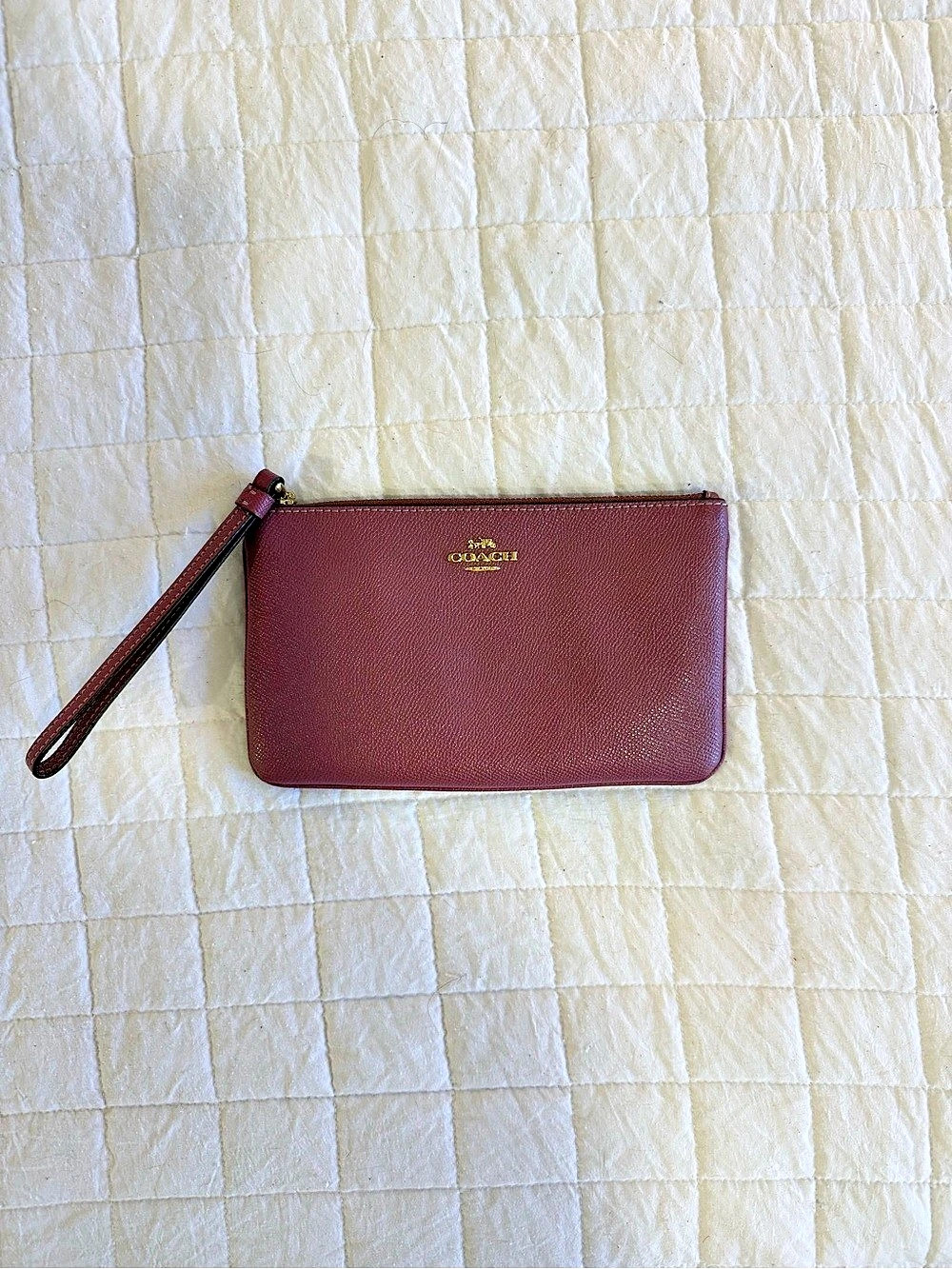Purple Coach zip wristlet wallet